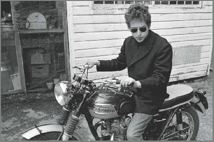 Rides his Triumph...